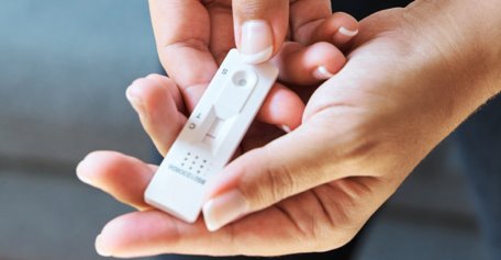 hand holding a covid test