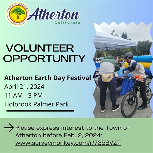 People standing at a booth with a bicycle