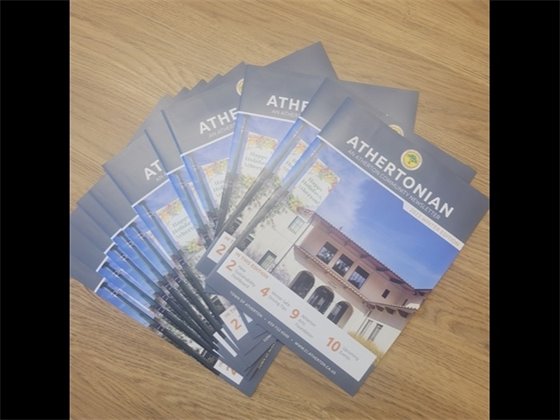 copies of Athertonian spread out on table