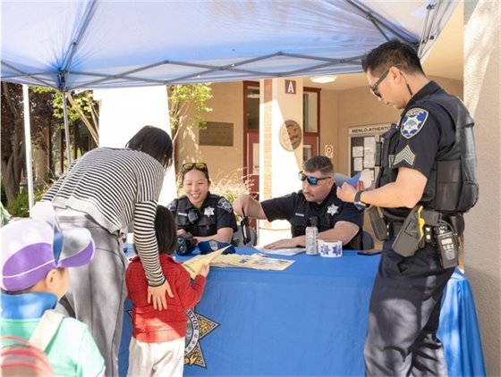 Police interacting with family at festival
