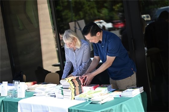 volunteers arranging books