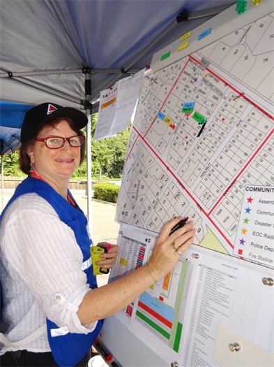 volunteers at poster board