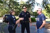 Photo from National Night Out of Police Department having a conversation with the community