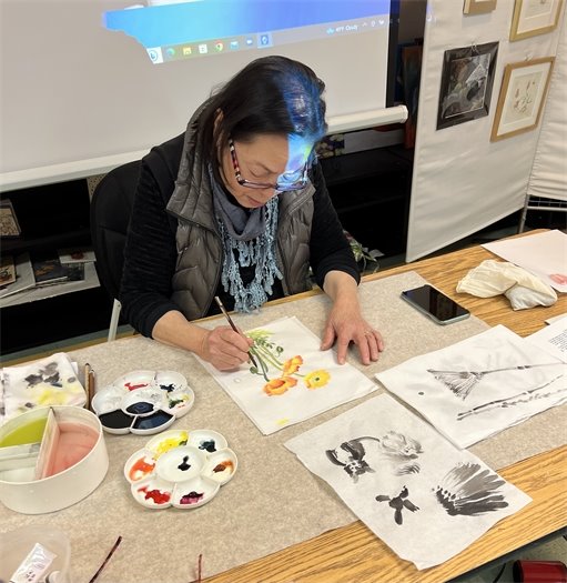 Artist brush painting flowers