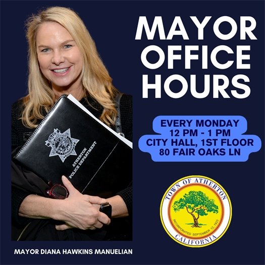 photo of the mayor holding a binder 